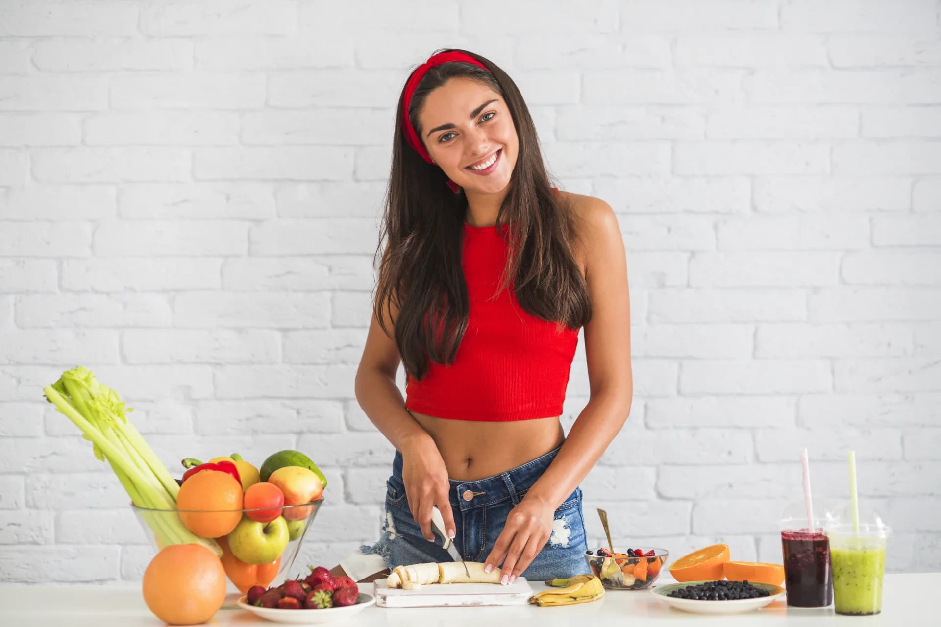 Woman preparing fresh fruit in a bright kitchen