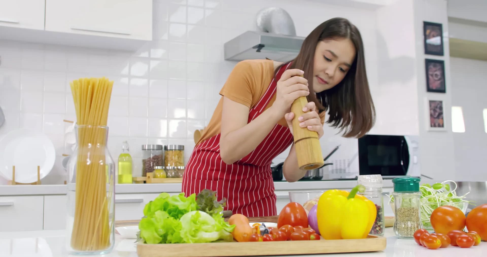 Woman preparing fresh ingredients in her kitchen