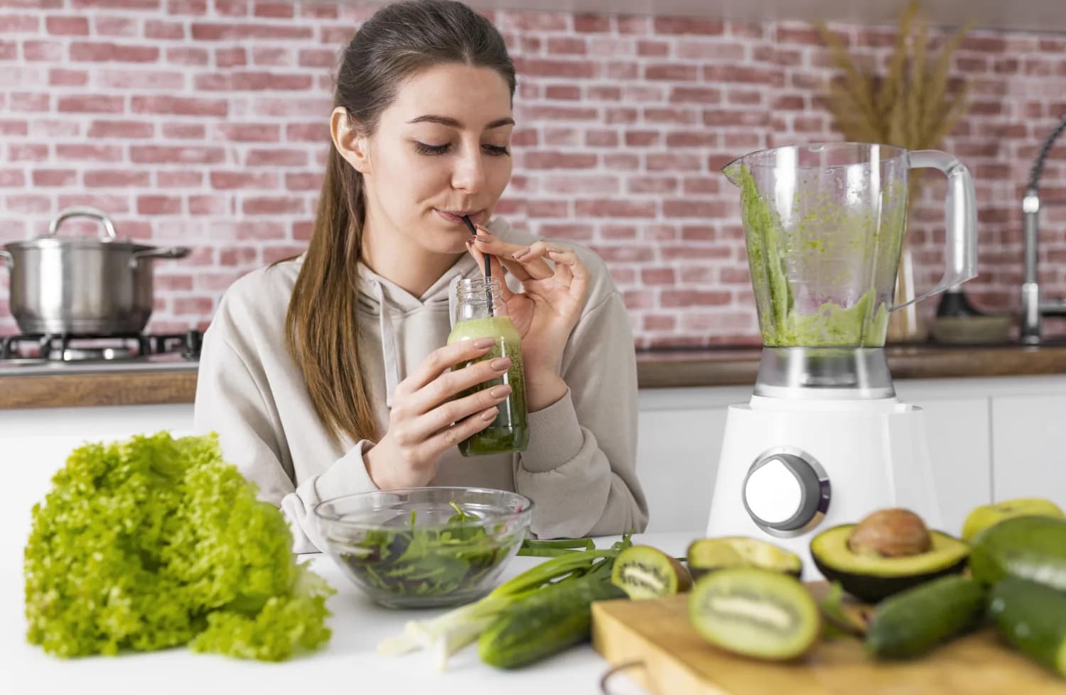 Fresh green smoothie with leafy summer ingredients